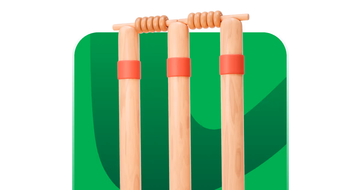Cricket stumps and bails on a green pitch